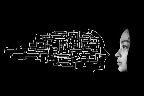 A face in profile against black, with circuit board traces forming the back of the head
