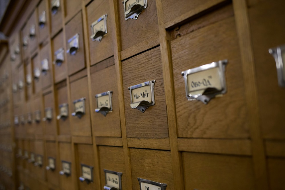 Wooden card catalogue drawers with metal label holders