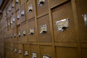 Wooden card catalogue drawers with metal label holders